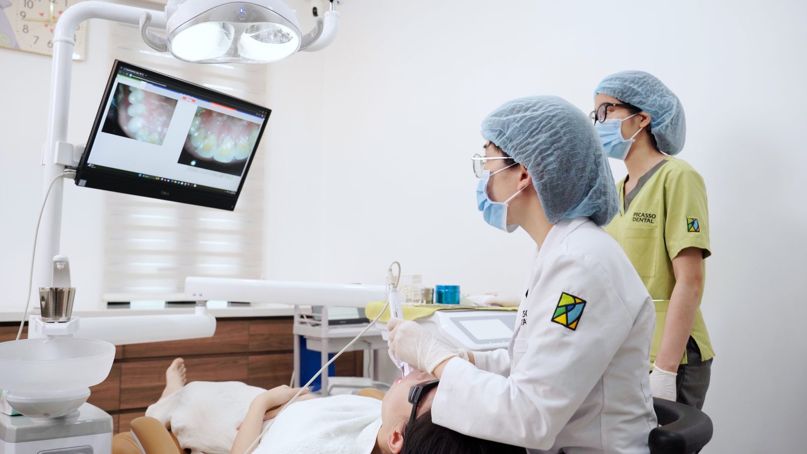 Dentist examining a patient at Picasso Dental Hanoi Westlake