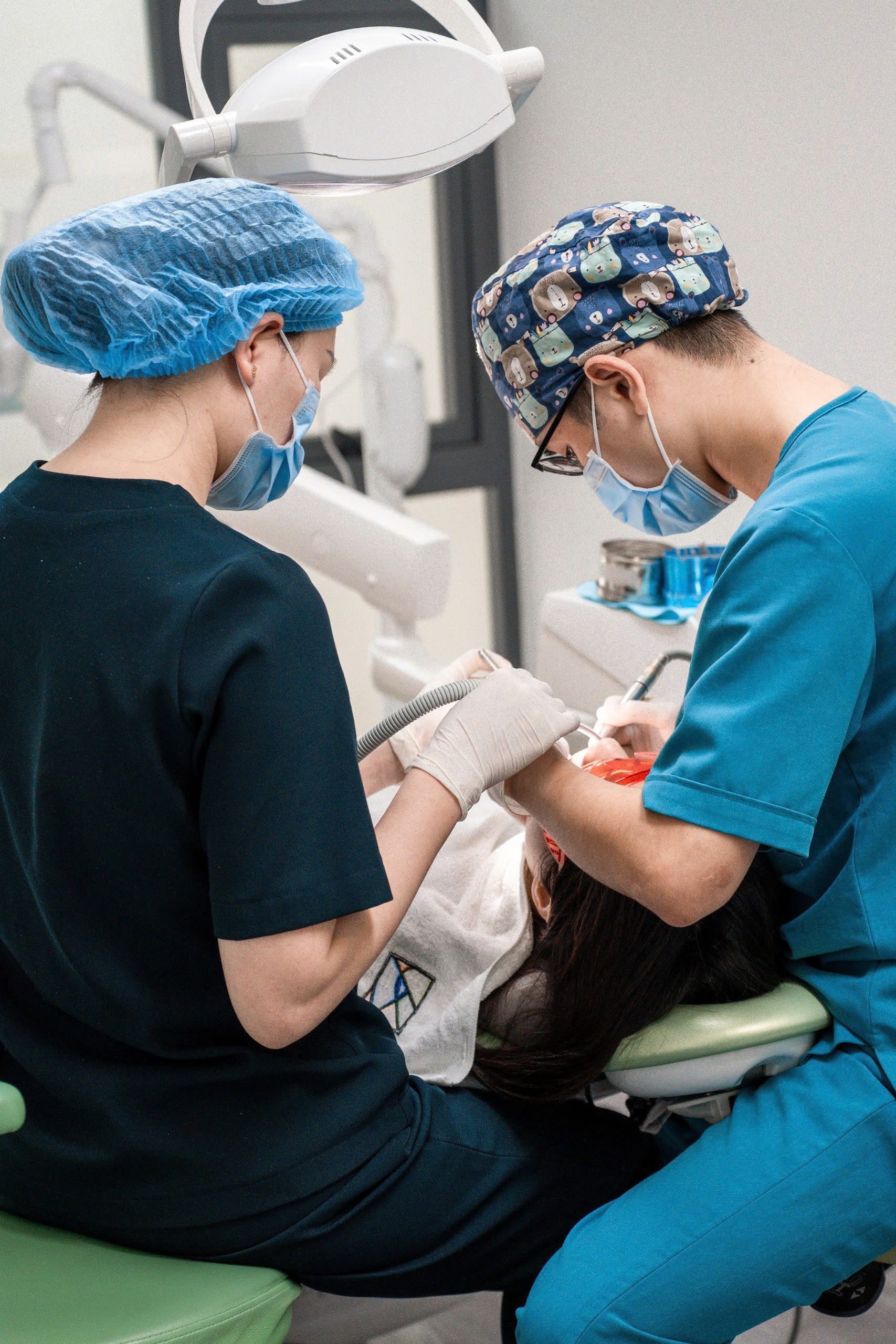 Two-person dental team treating emergency patient at Picasso Dental