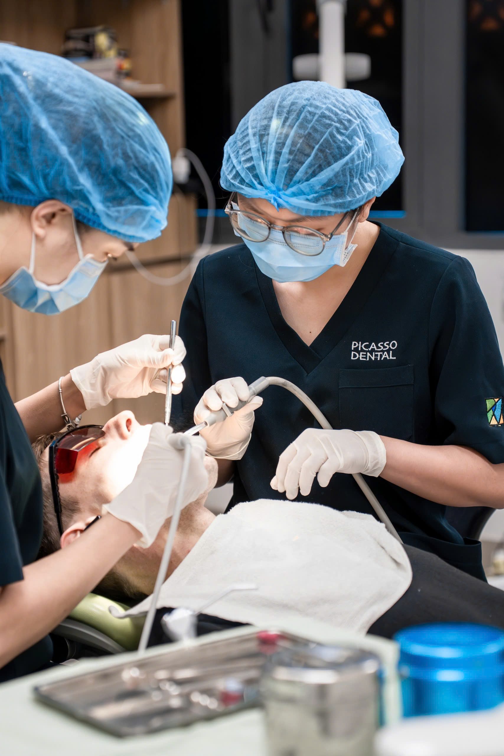 Dentist performing treatment at Picasso Dental Da Nang