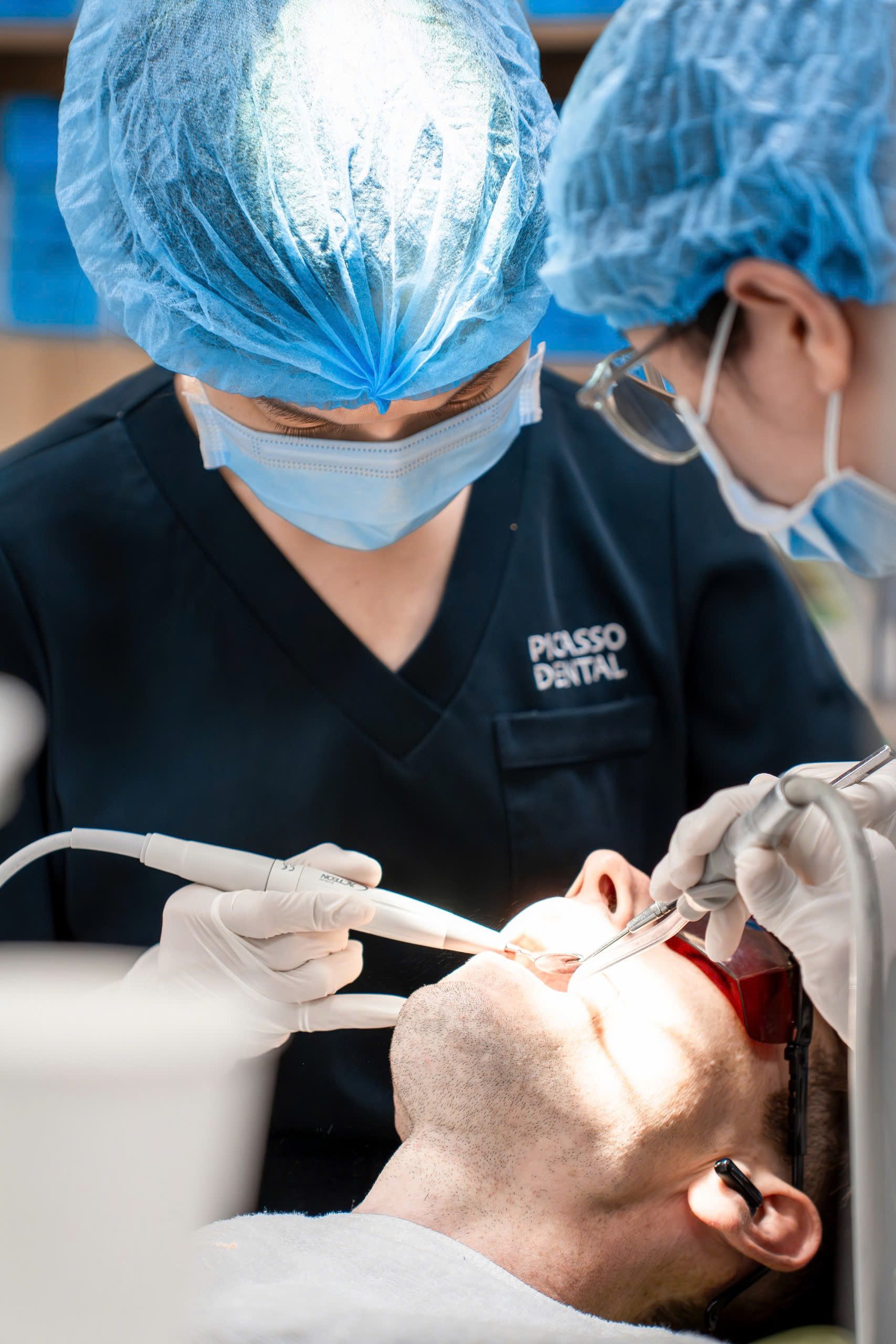 Dentist and nurse treating a patient at Picasso Dental