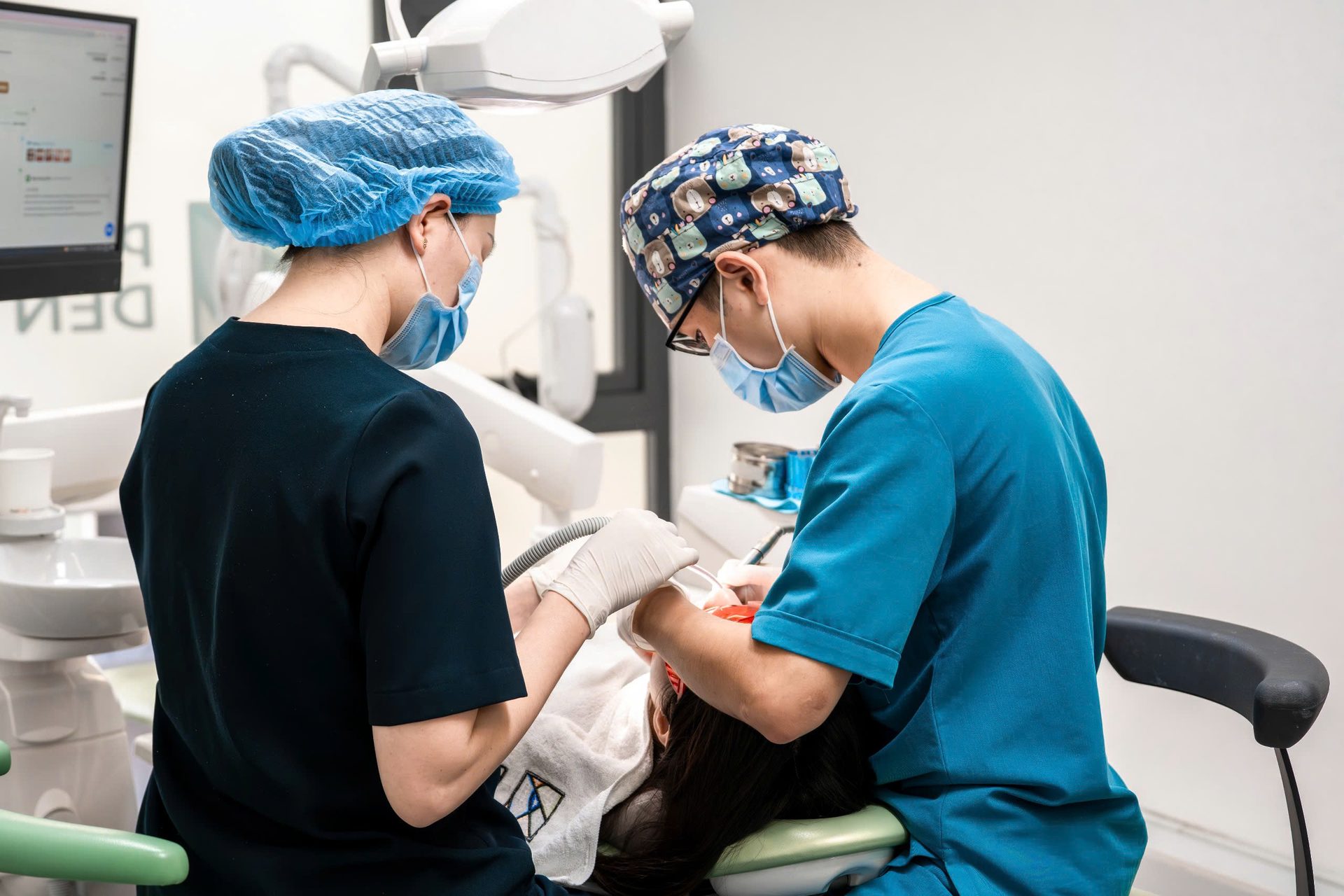 Dental team focused on patient treatment at Picasso Dental